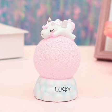 Nachtlampje eenhoorn op een roze bal